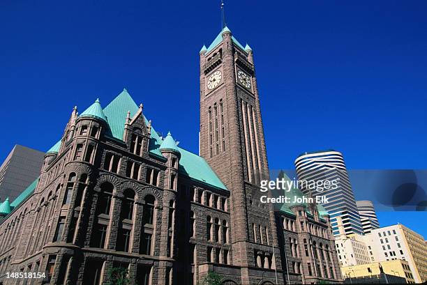 facade of city hall and the courthouse (1887), complete with clock tower - minneapolis-st paul, minnesota - minneapolis city council stock-fotos und bilder