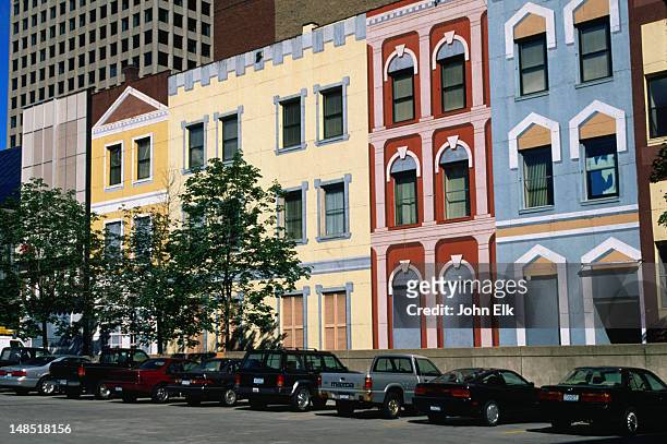 downtown street scene: cars parked outside painted houses - minneapolis-st paul, minnesota - minneapolis park stock pictures, royalty-free photos & images