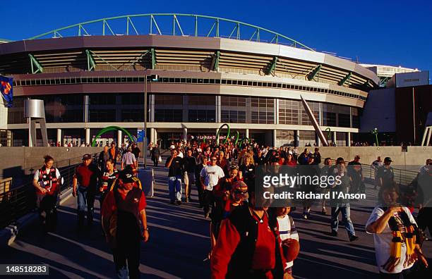football fans leaving the colonial stadium in melbourne's docklands - docklands stadium melbourne stock pictures, royalty-free photos & images