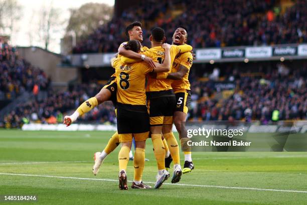 Ruben Neves, Matheus Nunes, Matheus Cunha and Mario Lemina of Wolverhampton Wanderers celebrate after Joachim Andersen of Crystal Palace scores an...