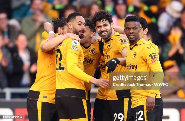 Wolverhampton Wanderers players celebrate after Joachim Andersen of Crystal Palace scores an own-goal, Wolverhampton Wanderers first goal during the...