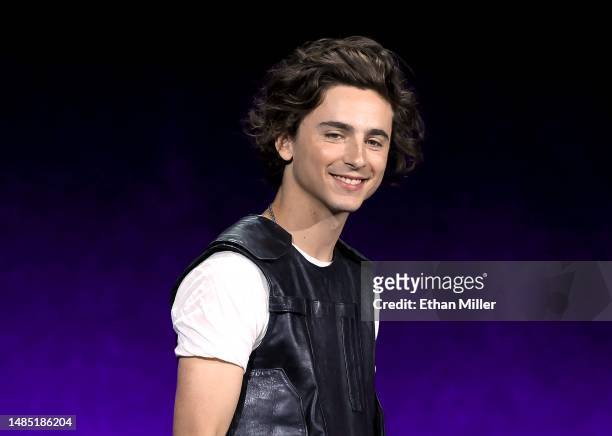 Timothée Chalamet speaks onstage as he promotes the film "Wonka" during the Warner Bros. Pictures Studio presentation during CinemaCon, the official...