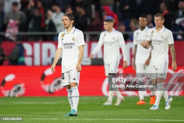 Luka Modric of Real Madrid looks dejected after Valentin Castellanos of Girona FC scores the team's third goal and completes their hat-trick during...