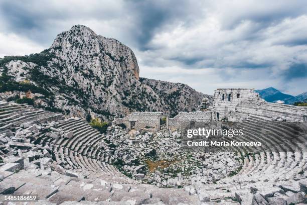 ruins of the amphitheatre, ancient city, termessos, antalya province, turkey. - artifact stock pictures, royalty-free photos & images