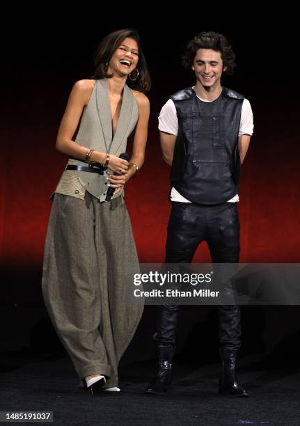 Zendaya and Timothée Chalamet speak onstage as they promote the upcoming film "Dune: Part Two" during the Warner Bros. Pictures Studio presentation...