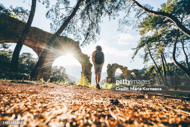 man walking in the historic antique city.  antalya province, turkey. - ancient rome food stock pictures, royalty-free photos & images