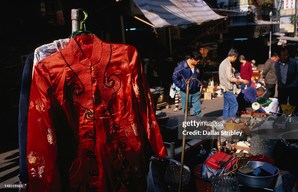 Chinese silk jacket for sale at street market in Central.