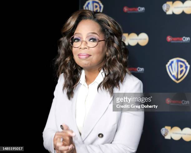 Oprah Winfrey attends the red carpet promoting the upcoming film "The Color Purple" during the Warner Bros. Pictures Studio presentation during...