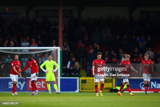 Swindon players show their dejection after conceding the opening goal during the Sky Bet League Two between Swindon Town and Stevenage at County...