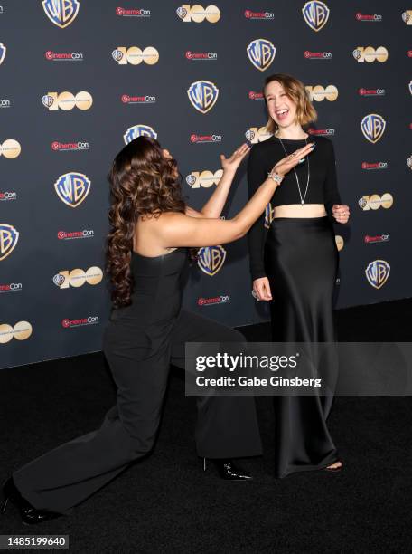 Storm Reid and Taissa Farmiga pose for photos as they promote the upcoming film "The Nun 2" during the Warner Bros. Pictures presentation at The...