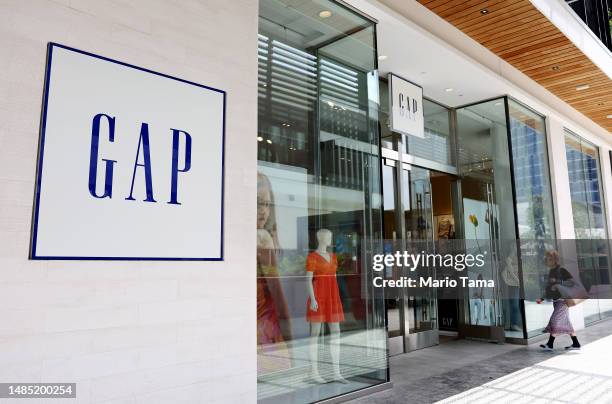 The Gap logo is displayed at a Gap store on April 25, 2023 in Los Angeles, California. Gap Inc. Is planning to cut hundreds of corporate employees...