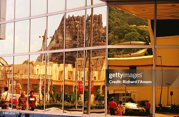 fishermanãs wharf theme park volcano reflected in windows of sands casino. - sands hotel & casino stock pictures, royalty-free photos & images