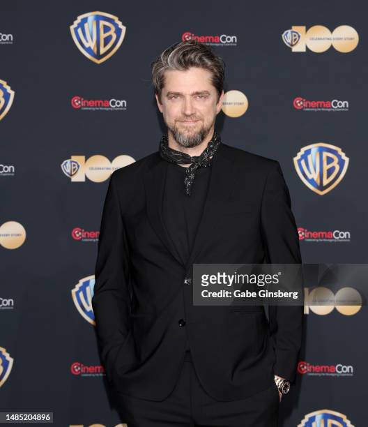Andy Muschietti poses for photos as he promotes the upcoming film "The Flash" during the Warner Bros. Pictures presentation at The Colosseum at...