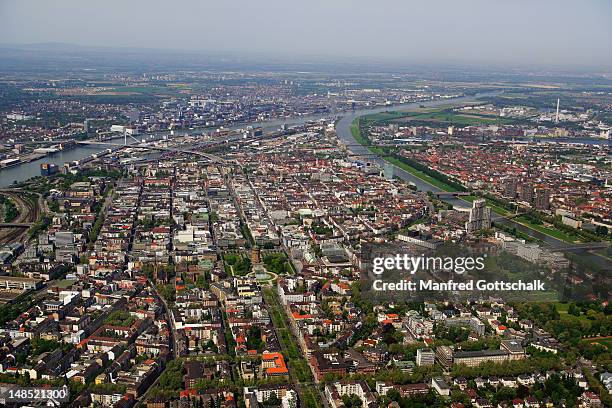 aerial view of city on right bank of rhine river at mouth of neckar river. - mannheim stock-fotos und bilder