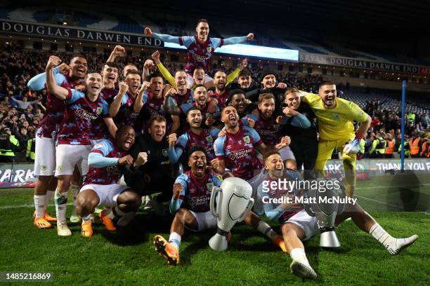 Burnley players celebrate after winning the Sky Bet Championship following victory against the Blackburn Rovers and Burnley at Ewood Park on April...