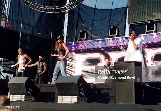 Singers Adrienne Bailon, Kiely Williams and Naturi Naughton of 3LW performs at Toyota Park in Bridgeview, Illinois in July 2001.