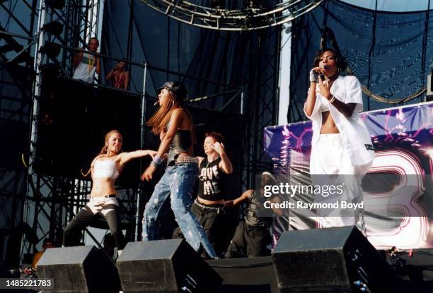 Singers Adrienne Bailon, Kiely Williams and Naturi Naughton of 3LW performs at Toyota Park in Bridgeview, Illinois in July 2001.