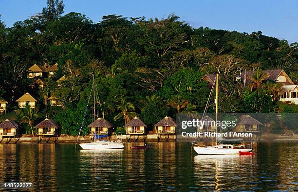 yachts on villa bay resort and bungalows on iririki island. - port vila stock pictures, royalty-free photos & images