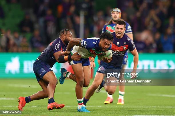 Adam Pompey of the Warriors is tackled during the round eight NRL match between Melbourne Storm and New Zealand Warriors at AAMI Park on April 25,...