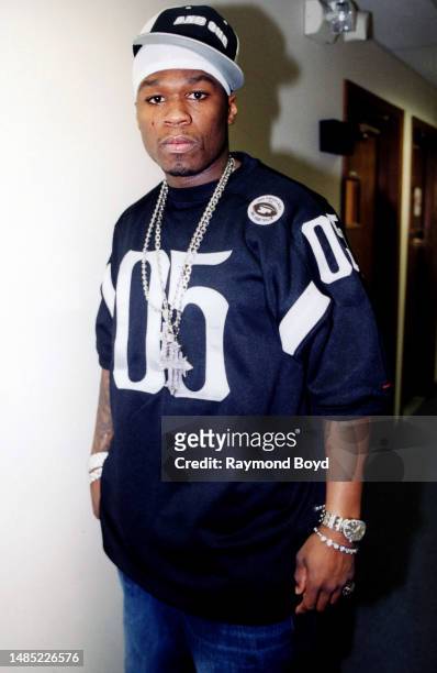 Rapper 50 Cent poses for photos during a visit to 106 Jamz radio in Lansing, Illinois in January 2003.
