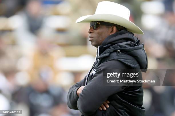 Head coach Deion Sanders of the Colorado Buffaloes watches as his team warms up prior to their spring game at Folsom Field on April 22, 2023 in...