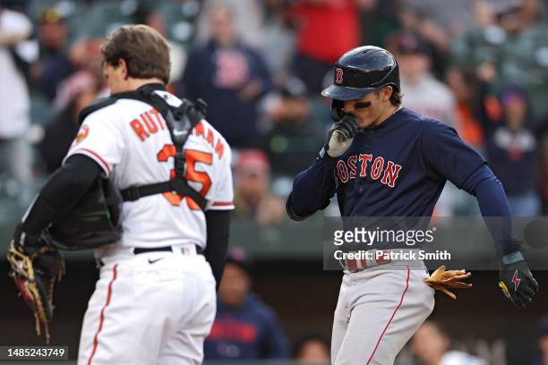 Jarren Duran of the Boston Red Sox celebrates as he crosses home plate after hitting a grand slam home run against the Baltimore Orioles during the...