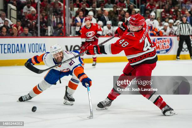 Jordan Martinook of the Carolina Hurricanes shoots the puck during the first period against the New York Islanders in Game Five of the First Round of...