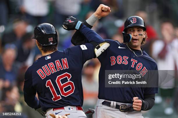 Jarren Duran of the Boston Red Sox celebrates his grand slam home run with teammate Triston Casas against the Baltimore Orioles during the third...