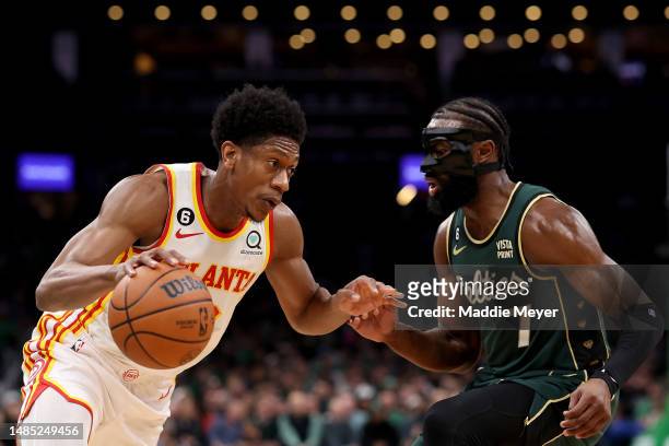 De'Andre Hunter of the Atlanta Hawks drives to the basket against Jaylen Brown of the Boston Celtics during the first quarter in game five of the...