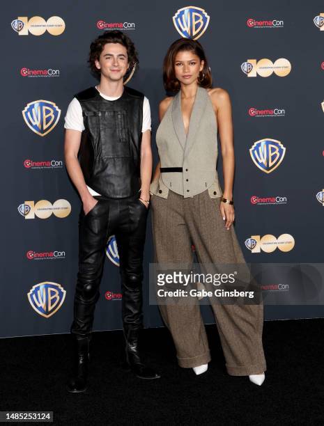 Timothee Chalamet and Zendaya pose for photos as they promote the upcoming film "Dune: Part Two" during the Warner Bros. Pictures presentation at The...
