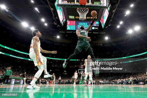 Jaylen Brown of the Boston Celtics shoots the ball against De'Andre Hunter of the Atlanta Hawks during the second quarter in game five of the Eastern...