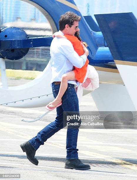 Tom Cruise and Suri Cruise are seen at west side heliport in Manhattan on July 18, 2012 in New York City.