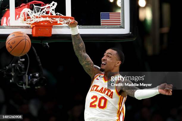 John Collins of the Atlanta Hawks dunks the ball against the Boston Celtics during the third quarter in game five of the Eastern Conference First...