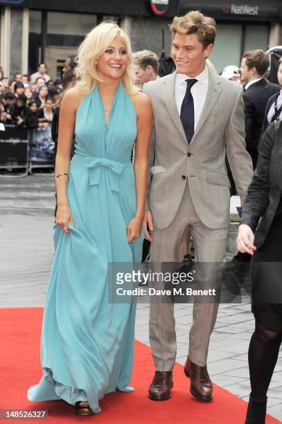 Pixie Lott and Oliver Cheshire attend the European Premiere of 'The Dark Knight Rises' at Odeon Leicester Square on July 18, 2012 in London, England.