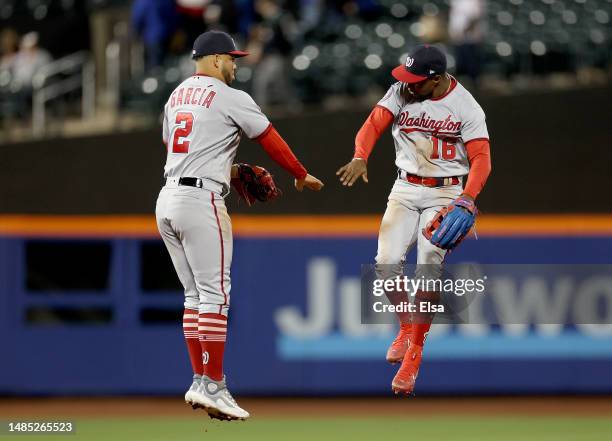 Luis Garcia and Victor Robles of the Washington Nationals celebrate the win over the New York Mets at Citi Field on April 25, 2023 in the Flushing...