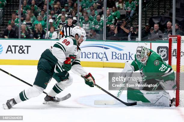 Jake Oettinger of the Dallas Stars blocks a shot on goal against Marcus Johansson of the Minnesota Wild in the second period in Game Five of the...