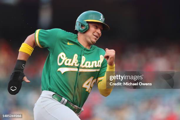 Ryan Noda of the Oakland Athletics rounds third base to score off of a triple from Jace Peterson during the first inning against the Los Angeles...