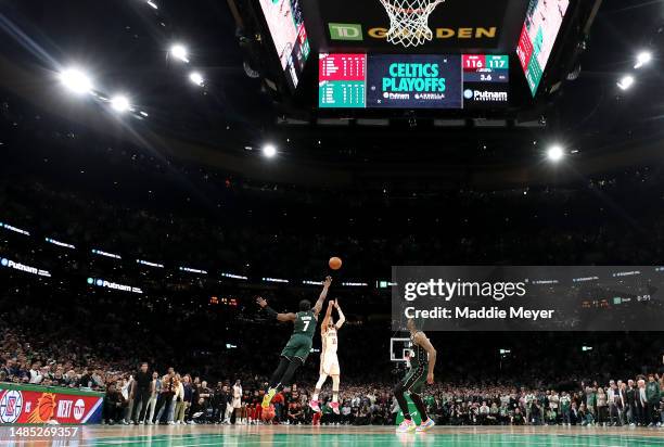 Trae Young of the Atlanta Hawks shoots the game winning 29-foot three point basket against Jaylen Brown of the Boston Celtics during the fourth...