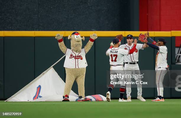 Kevin Pillar, Sam Hilliard and Ronald Acuna Jr. #13 of the Atlanta Braves celebrate their 7-4 win over the Miami Marlins at Truist Park on April 25,...