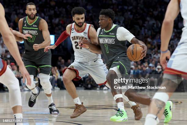 Anthony Edwards of the Minnesota Timberwolves drives against Jamal Murray of the Denver Nuggets in the first quarter during Round 1 Game 5 of the NBA...