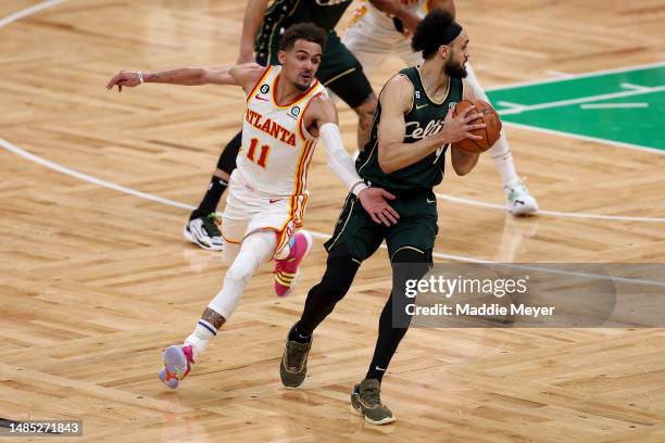 Trae Young of the Atlanta Hawks defends Derrick White of the Boston Celtics during the fourth quarter in game five of the Eastern Conference First...