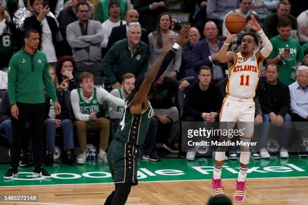 Trae Young of the Atlanta Hawks shoots the ball against Robert Williams III of the Boston Celtics during the fourth quarter in game five of the...