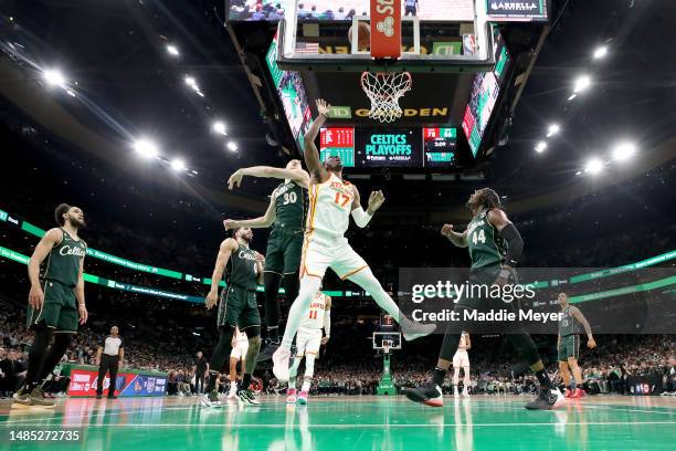 Onyeka Okongwu of the Atlanta Hawks shoots the ball against Sam Hauser of the Boston Celtics during the third quarter in game five of the Eastern...