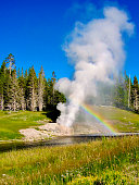 Riverside Geyser Produces Rainbow, Yellowstone National Park, Wyoming (USA)