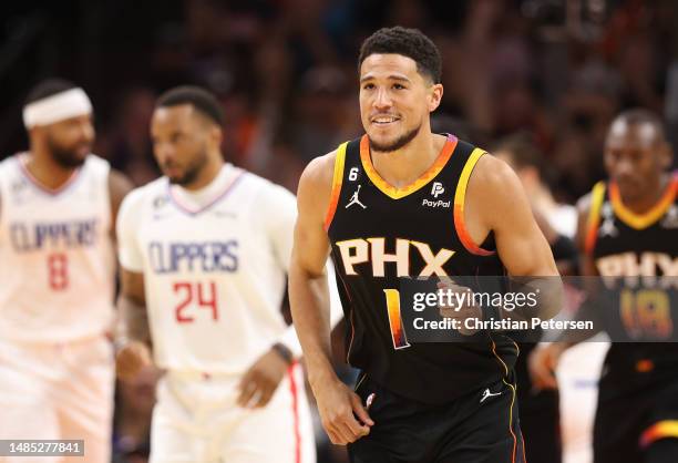 Devin Booker of the Phoenix Suns reacts during the second quarter against the LA Clippers in game five of the Western Conference First Round Playoffs...