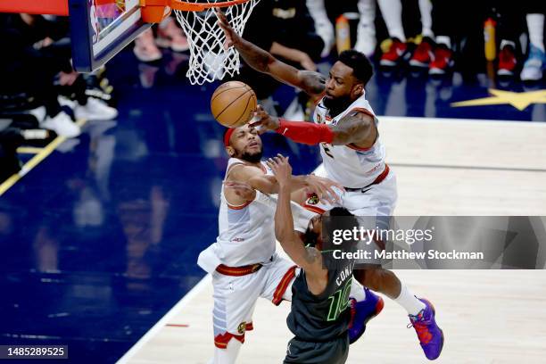 Bruce Brown and Jeff Green of the Denver Nuggets block Mike Conley of the Minnesota Timberwolves in the fourth quarter during Round 1 Game 5 of the...