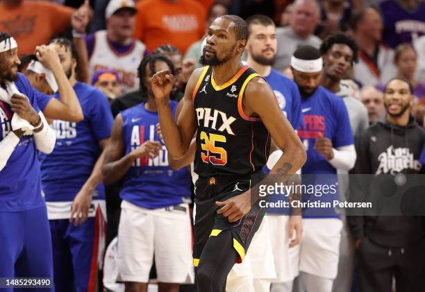 Kevin Durant of the Phoenix Suns celebrates during the fourth quarter against the LA Clippers in game five of the Western Conference First Round...