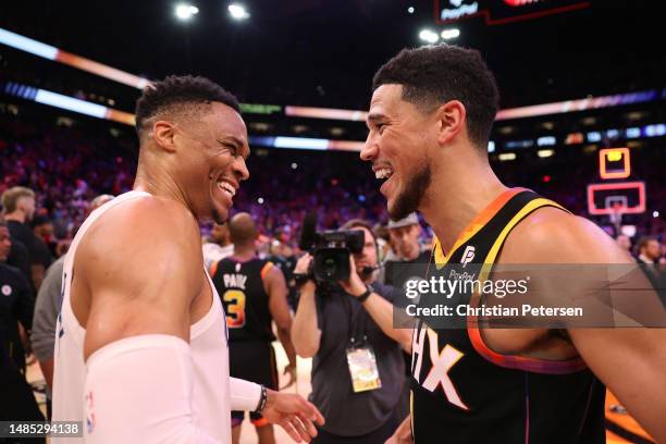 Russell Westbrook of the LA Clippers reacts with Devin Booker of the Phoenix Suns after the Suns defeated the Clippers 136-130 in game five of the...