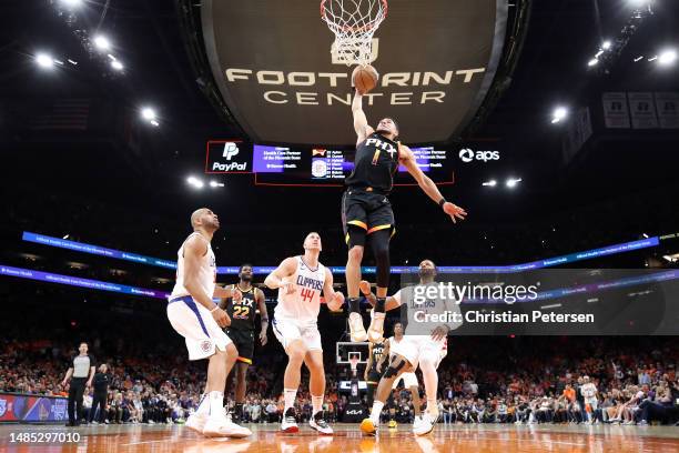 Devin Booker of the Phoenix Suns dunks the ball during the third quarter against the LA Clippers in game five of the Western Conference First Round...