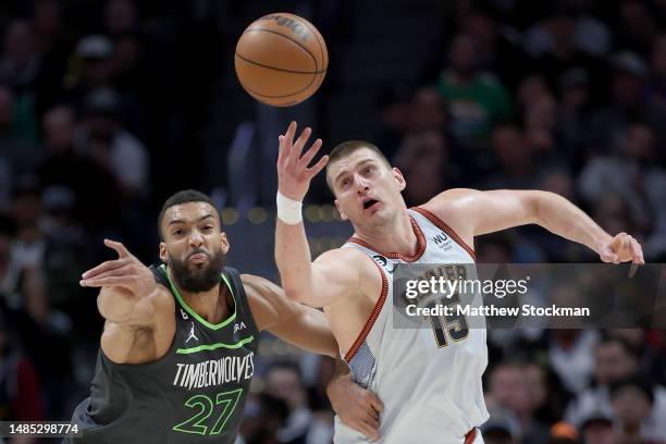 Rudy Gobert of the Minnesota Timberwolves fights for a lose ball against Nikola Jokic of the Denver Nuggets in the second quarter during Round 1 Game...